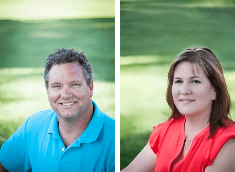 Man and woman smiling outdoors.